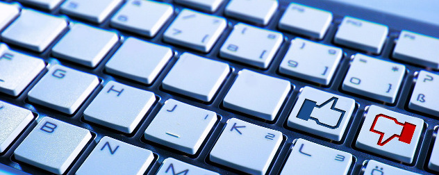 keyboard modified with Facebook-style thumbs-up and thumbs-down keys