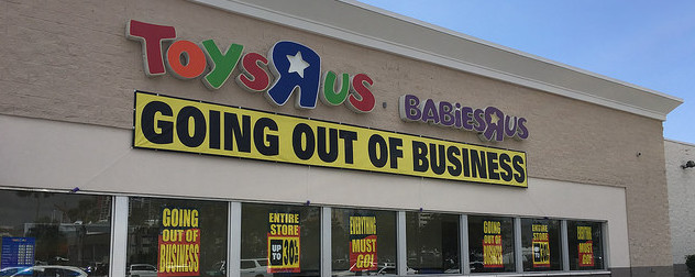 Toys R Us exterior with going out of business signs