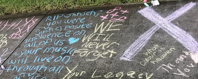 chalk messages on a sidewalk memorial to XXXTentacion