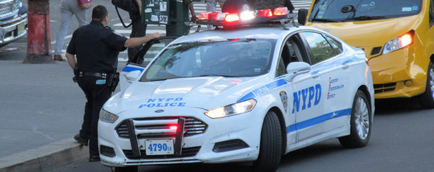 NYPD vehicle parked on a curb