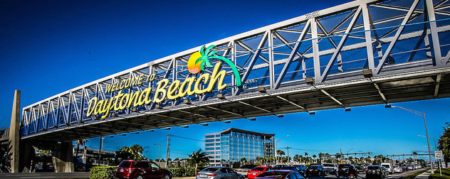 bridge with sign reading 'Welcome To Daytona Beach'