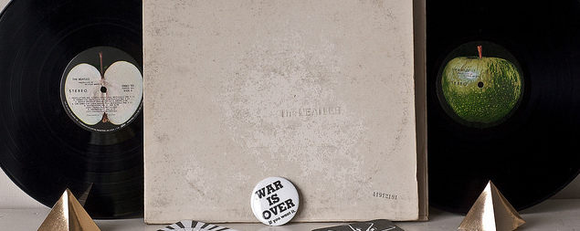 still life of 'The Beatles'/the 'White Album' double LP with a 'War Is Over' button