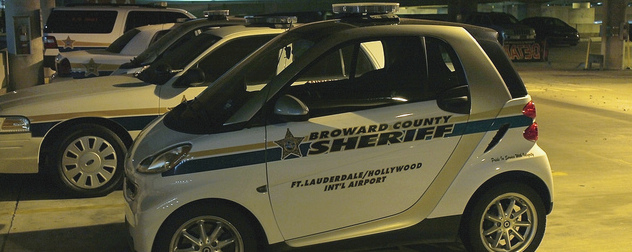 small car stamped with the Broward County Sheriff designation, with Ft. Lauderdale/Hollywood Int'l Airport beneath