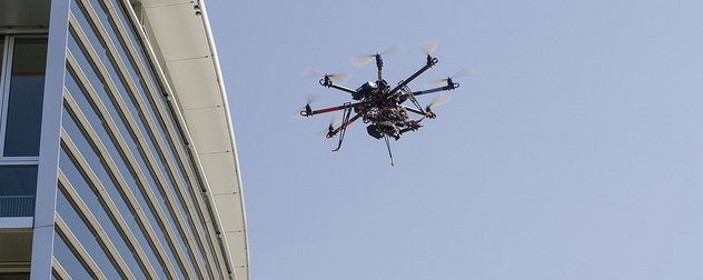 drone in flight near a building.