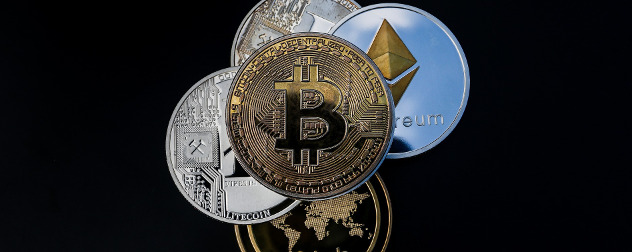 coins with various cryptocurrency symbols, including bitcoin, ethereum and others, on black background