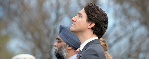 Justin Trudeau, looking up at the sky.