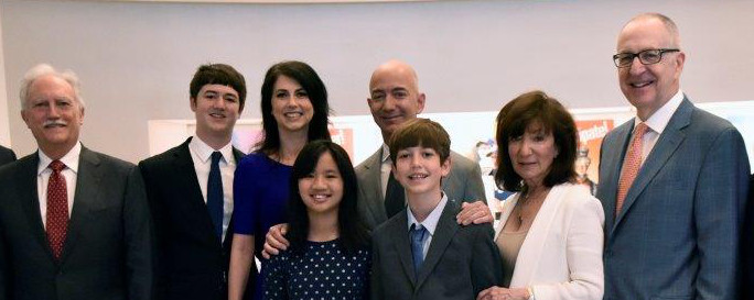 group photo at 2016 naturalization ceremony, with Jeff and MacKenzie Bezos in the center.