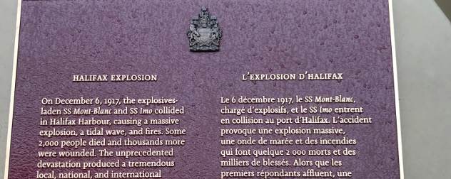 detail of a commemorative plaque, in English and French, discussion the Halifax Explosion of 1917.