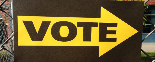 vote sign with yellow arrow.