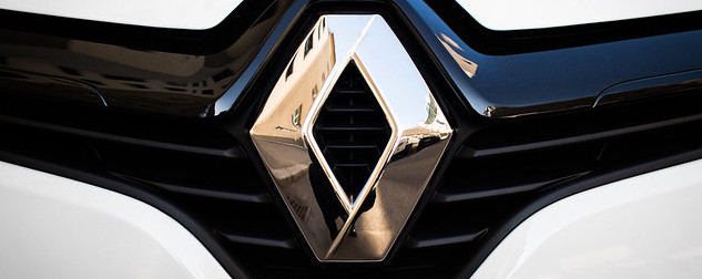 Renault logo on a car grill, detail.