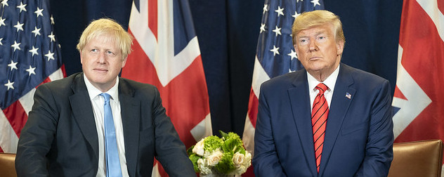 Boris Johnson and Donald Trump seated before U.K. and U.S. flags.