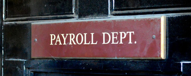 black door with red sign that reads 'Payroll Department'.