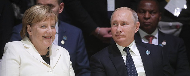 Chancellor of Germany, Angela Merkel, and President of Russia, Vladimir Putin, at the 2018 Paris Peace Forum