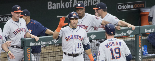 baseball player Carlos Beltran giving his Houston Astros teammate a high-five.