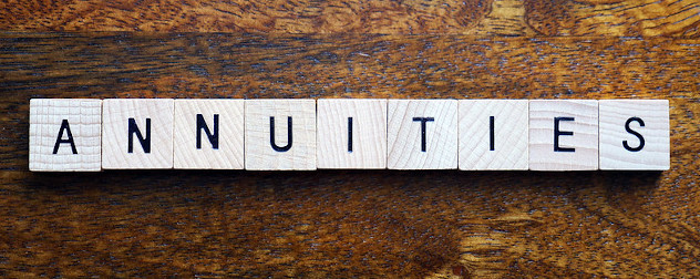 the word annuities spelled out in Scrabble-like wooden tiles.