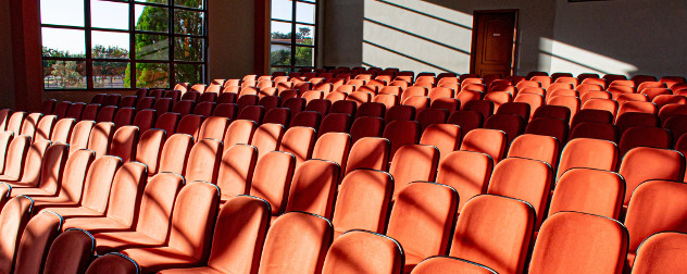 empty seats in a sunny conference room.