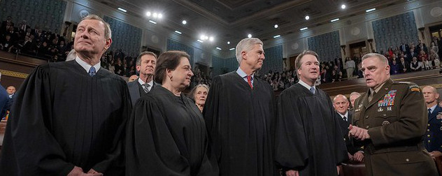 Chairman of the Joint Chiefs of Staff, Mark A. Milley, speaks with U.S. Supreme Court Associate Justices at the State of the Union address