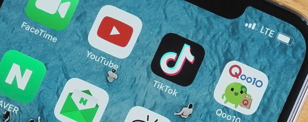 detail of YouTube and TikTok apps on smartphone.