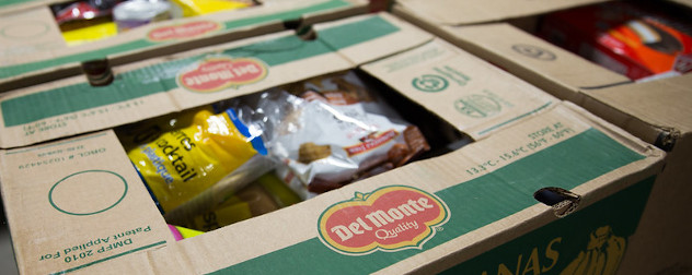 cardboard boxes in a food bank, loaded with nonperishable food.