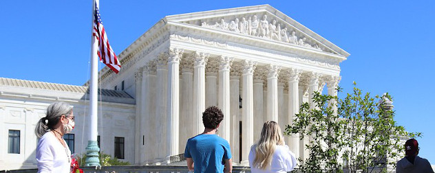 passersby outside the Supreme Court of the United States.