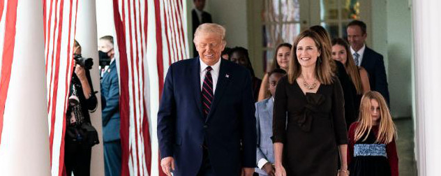 President Donald Trump walks with Amy Coney Barrett outside the White House.