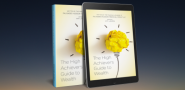 cover of The High Achiever's Guide to Wealth on a paperback and a tablet.