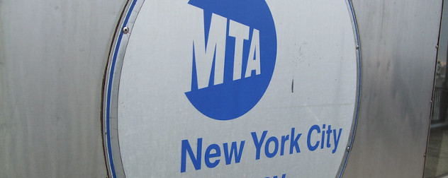 Metropolitan Transportation Authority (MTA) logo on the side of a New York City subway car.