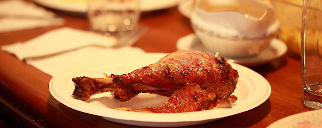turkey drumstick on a plate for Thanksgiving dinner.