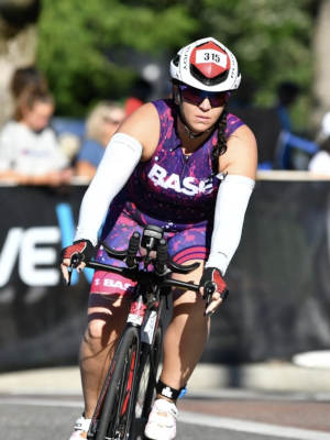 Ashley Luhmann participating in the bike portion of a triathalon.