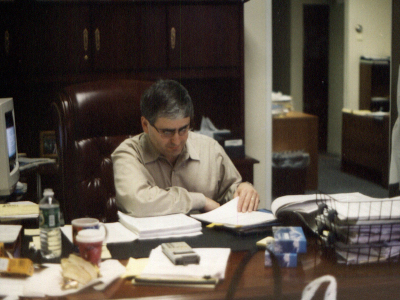 Larry Elkin working at a desk.