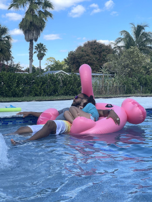 Jeffrey Howard and one of his daughters in a pool.