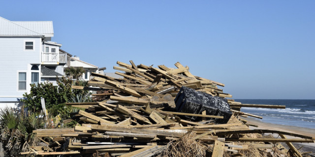 debris on a beach following Hurricane Matthew.