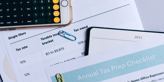 Smartphone and tax prep documents.