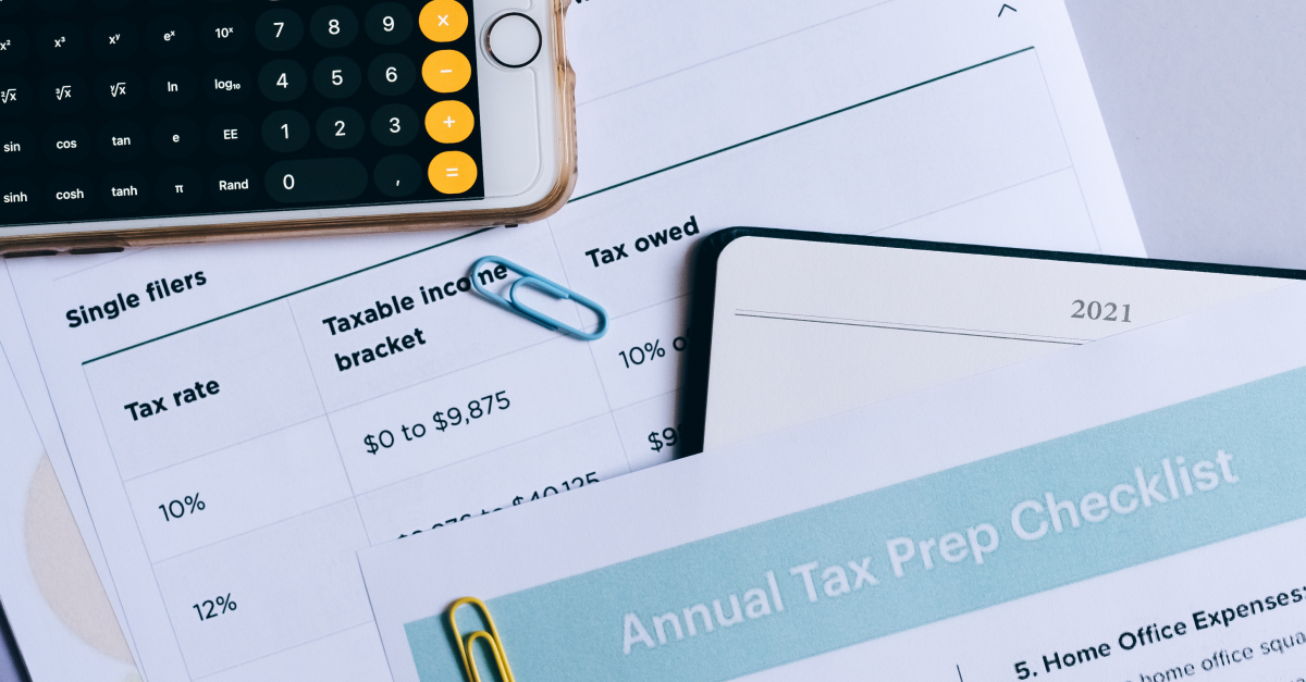 smartphone and tax-planning documents.