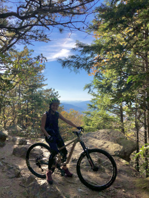 Victoria Dubuc biking in nature.