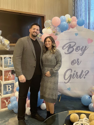 Cristina Galante and her husband at a baby announcement party.